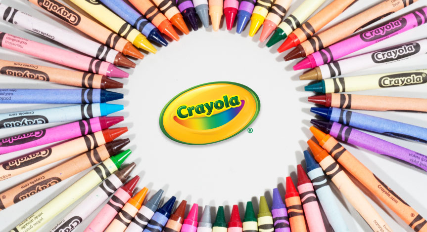 An assortment of Crayola crayons in a circle with the Crayola logo in the center